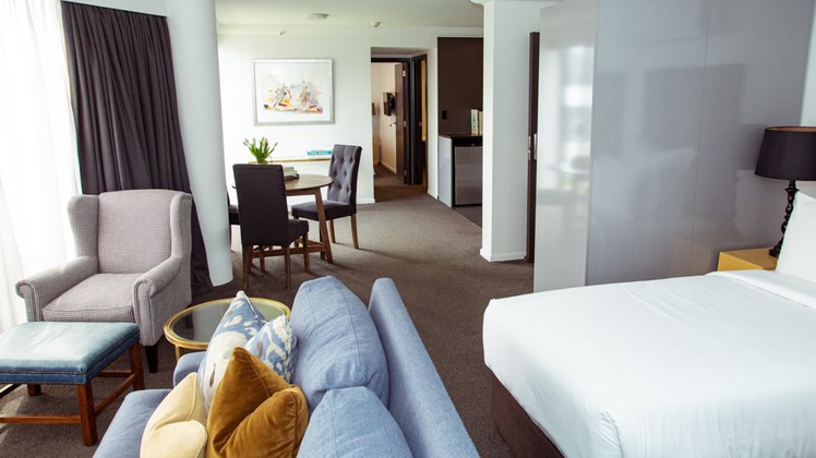 Family Suite bedroom and living space at Hotel Montreal