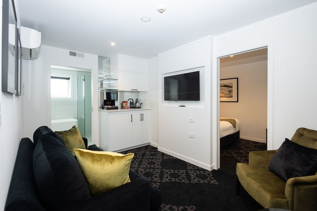 Living area and bedroom entrances in a Two Bedroom Family Room at The Regent Rotorua