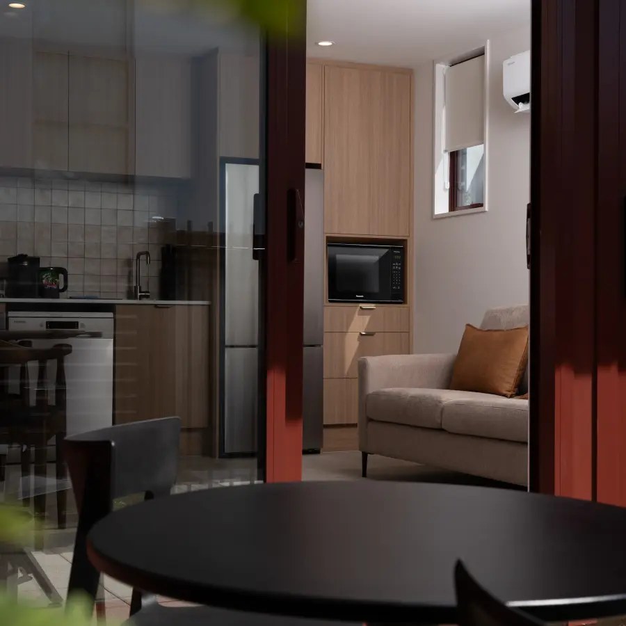 Kitchen and lounge in a Kilmore Collection apartment