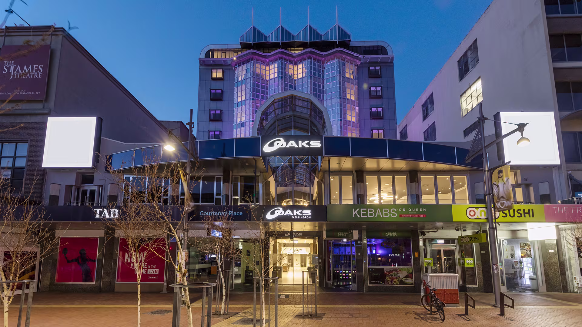 The Oaks Hotel Wellington tower on a city street in central Wellington