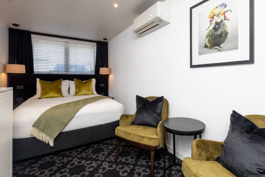 Compact Cutie Room with a double bed and seating at The Regent Rotorua